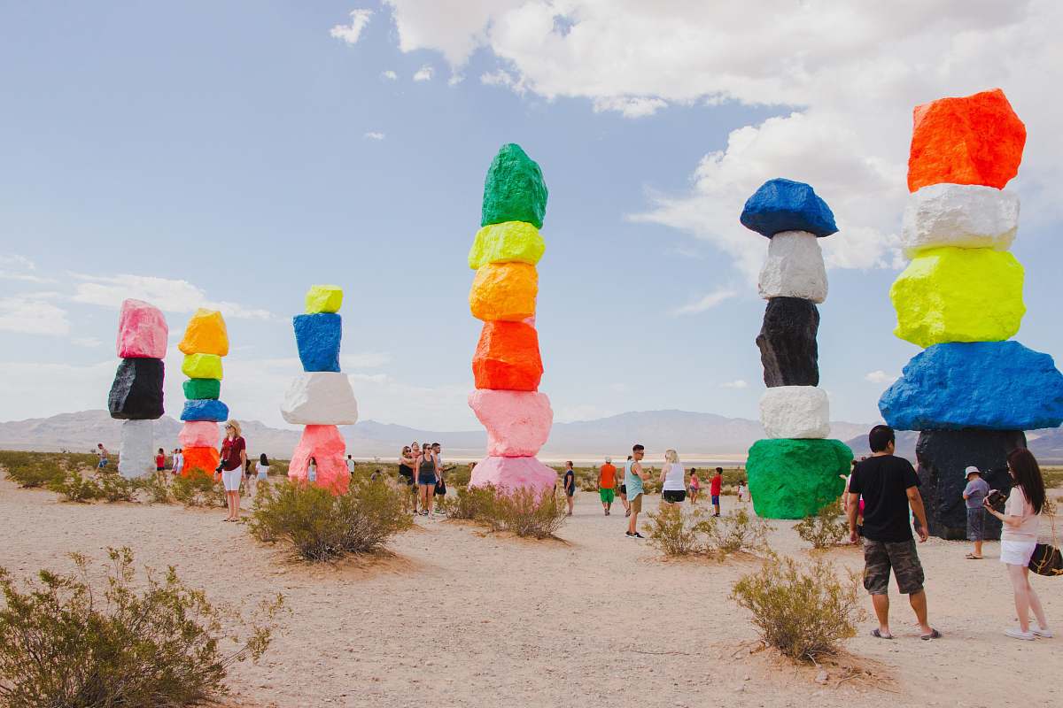 united states people sightseeing at multicolored stacked rocks landmark during daytime rock